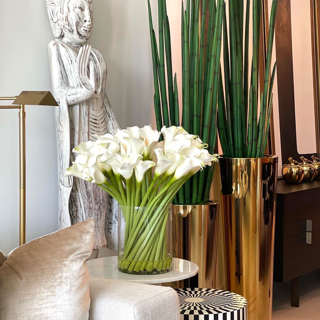 Cala lilies in a 10-inch glass cylinder