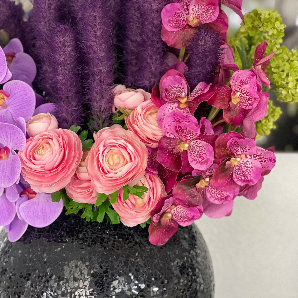 Black mosaic vase with liatris and orchids