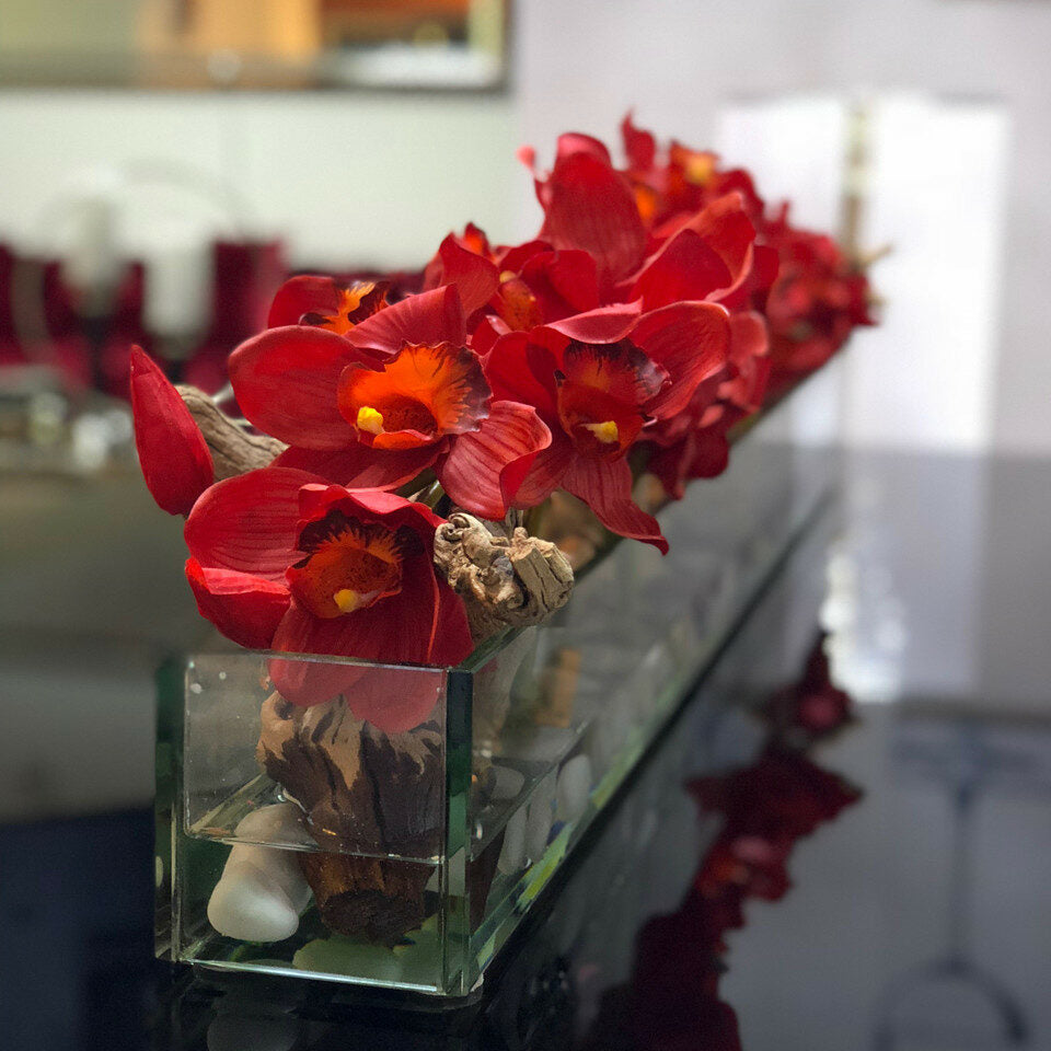 Modern glass vase in living style with red Cymbidium