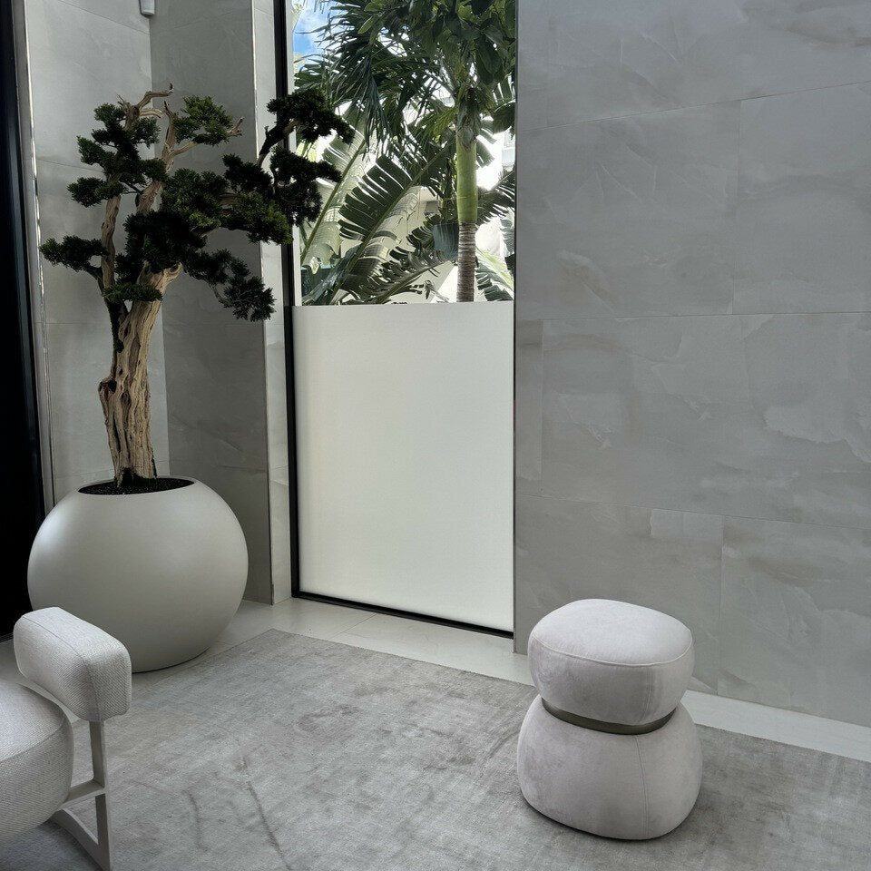 Bonsai tree standing on a 30-inch satin beige ball