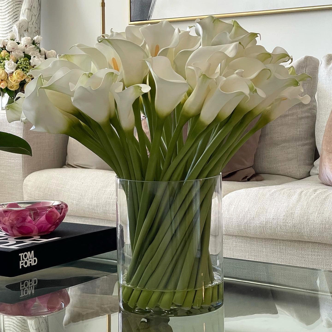 Cala lilies in a 10-inch glass cylinder