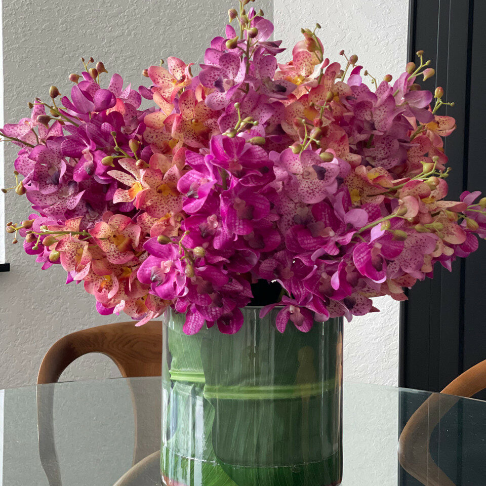 Mokara orchids mixed in a large Rota cylinder