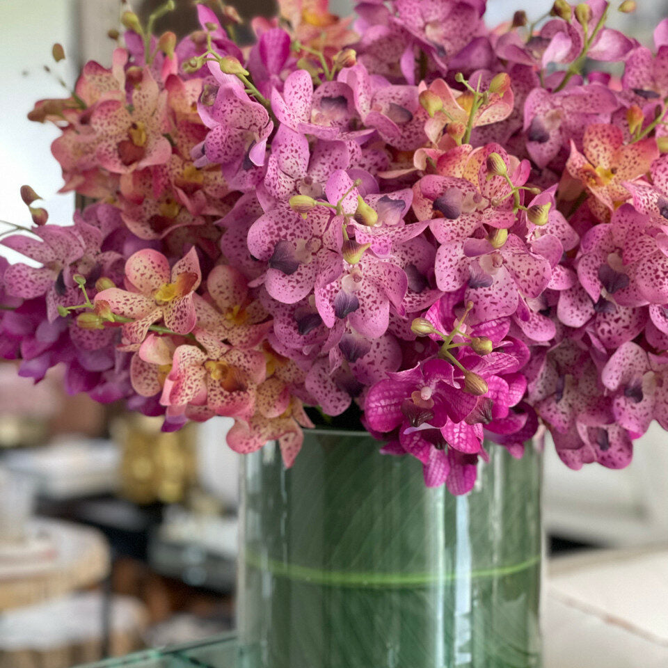 Mokara orchids mixed in a large Rota cylinder