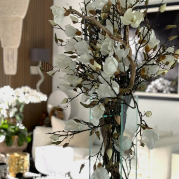 Vase with white magnolias in a modern house 50 cm high
