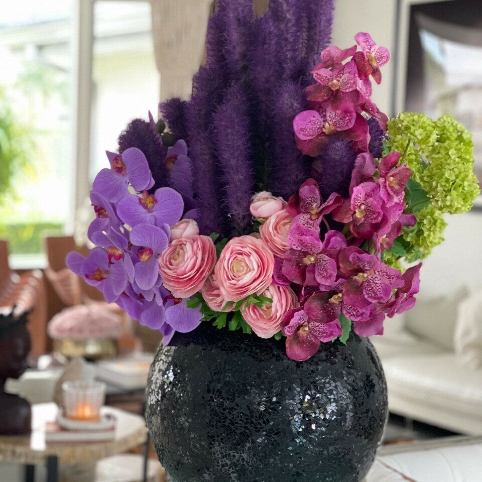Black mosaic vase with liatris and orchids