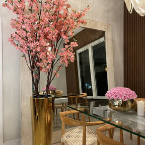 Large cherry blossom tree in a golden pot