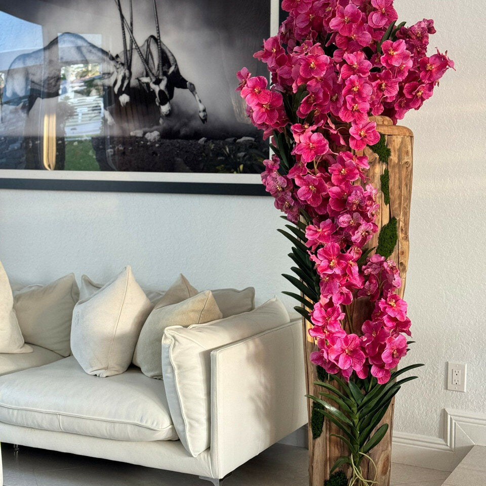 Large teak vase with natural edges and pink Vanda orchids
