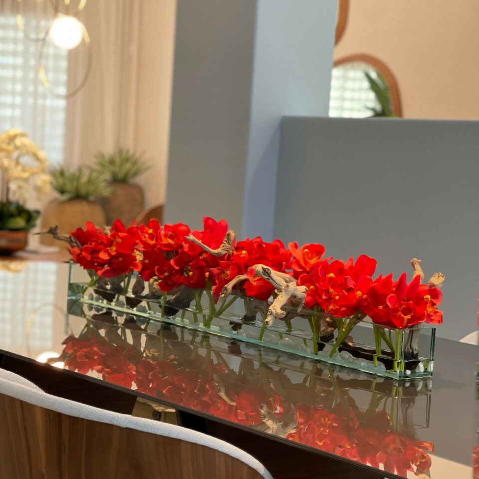 Modern glass vase in living style with red Cymbidium