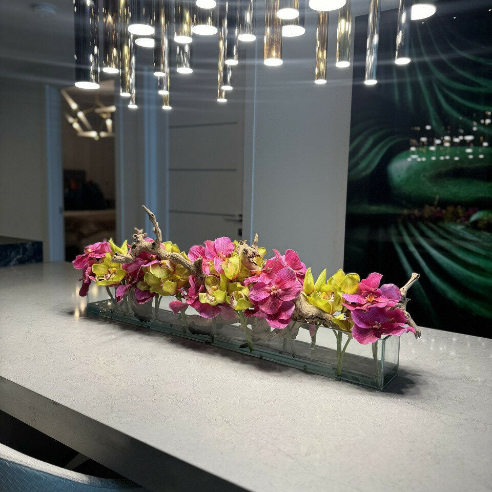 Modern glass vase with pink Vandas and green Cymbidium