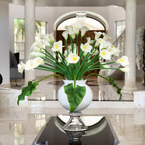 Elegant vase with several white calla lilies