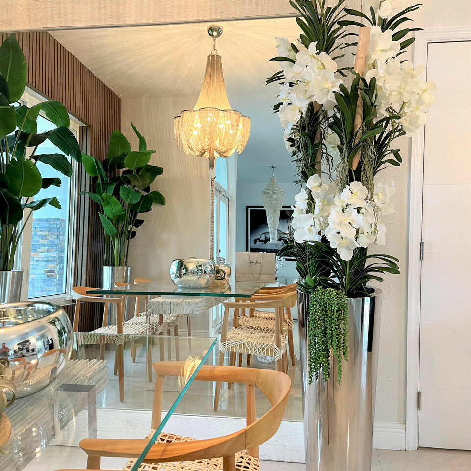 White Vandas in a conical stainless steel planter