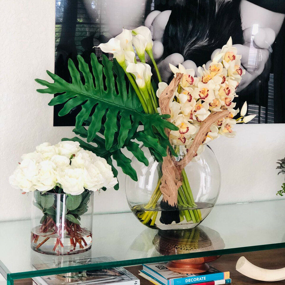 Moon vase with cymbidiums and callas