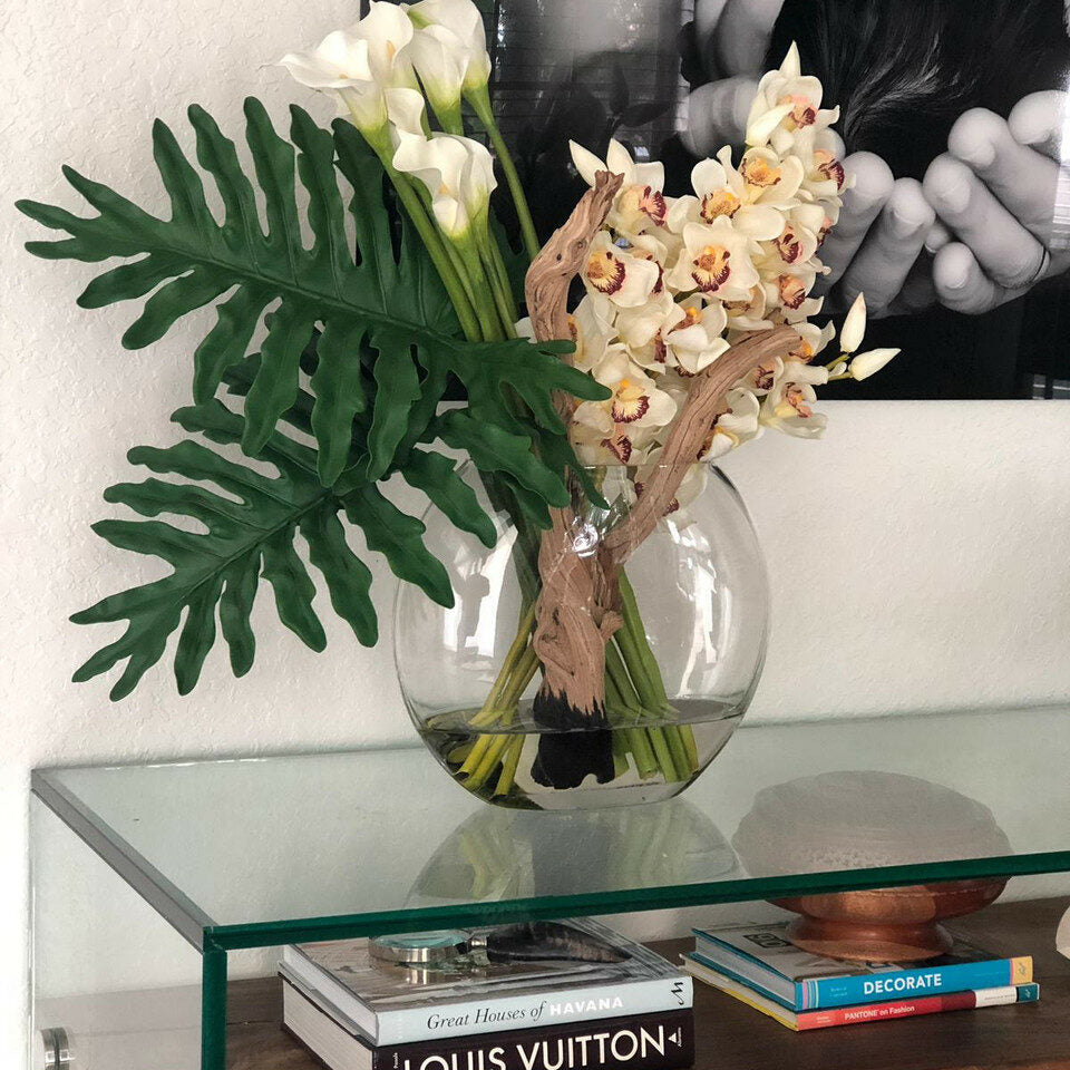 Moon vase with cymbidiums and callas