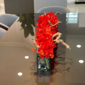 Modern glass vase in living style with red Cymbidium