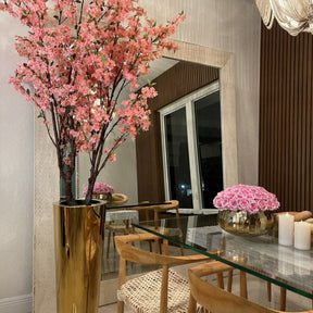 Large cherry blossom tree in a golden pot