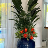 Tropical plant mix in a cobalt blue spherical pot