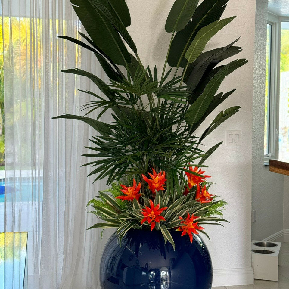 Tropical plant mix in a cobalt blue spherical pot