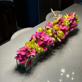 Modern glass vase with pink Vandas and green Cymbidium