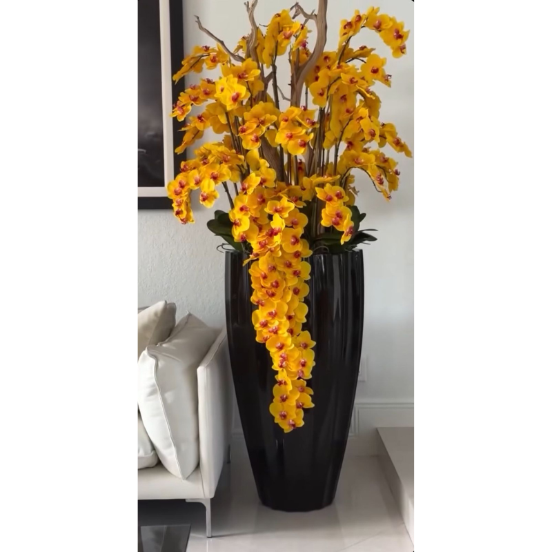 Glossy black San José vase with yellow orchid cascade