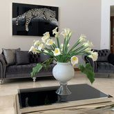 Elegant vase with several white calla lilies
