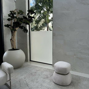 Bonsai tree standing on a 30-inch satin beige ball