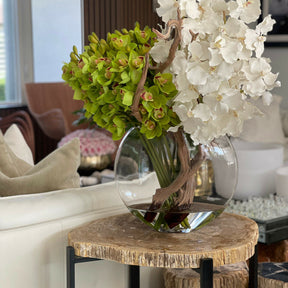 Moon vase with white Vanda orchids and green Cymbidiums