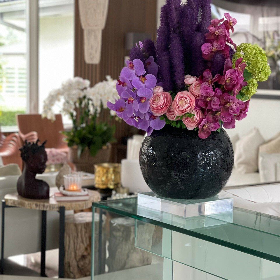 Black mosaic vase with liatris and orchids