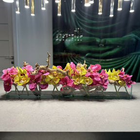Modern glass vase with pink Vandas and green Cymbidium