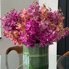 Mokara orchids mixed in a large Rota cylinder