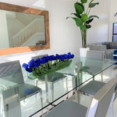 Modern glass vase with blue tulips