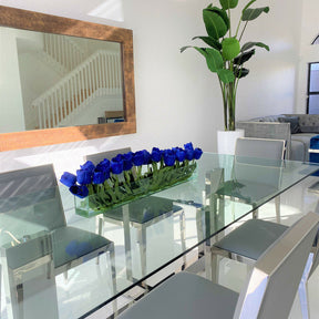 Modern glass vase with blue tulips