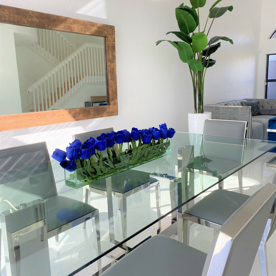 Modern glass vase with blue tulips