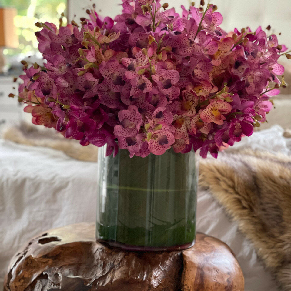 Mokara orchids mixed in a large Rota cylinder
