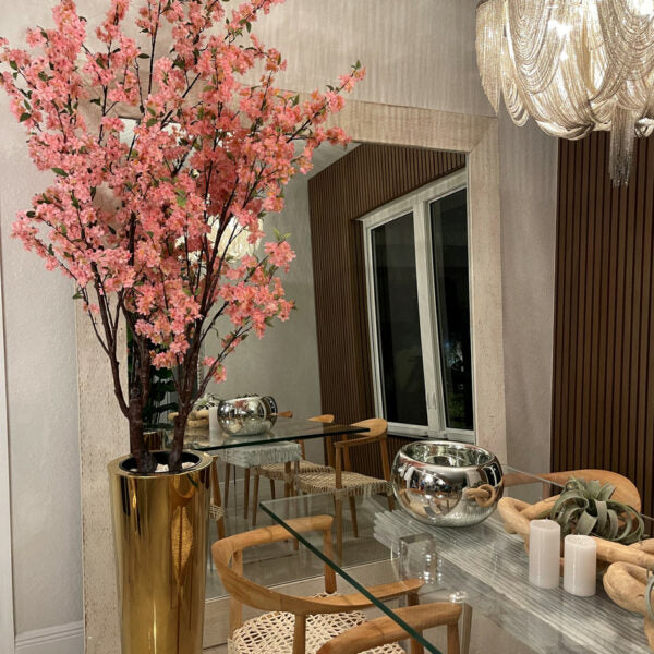 Large cherry blossom tree in a golden pot