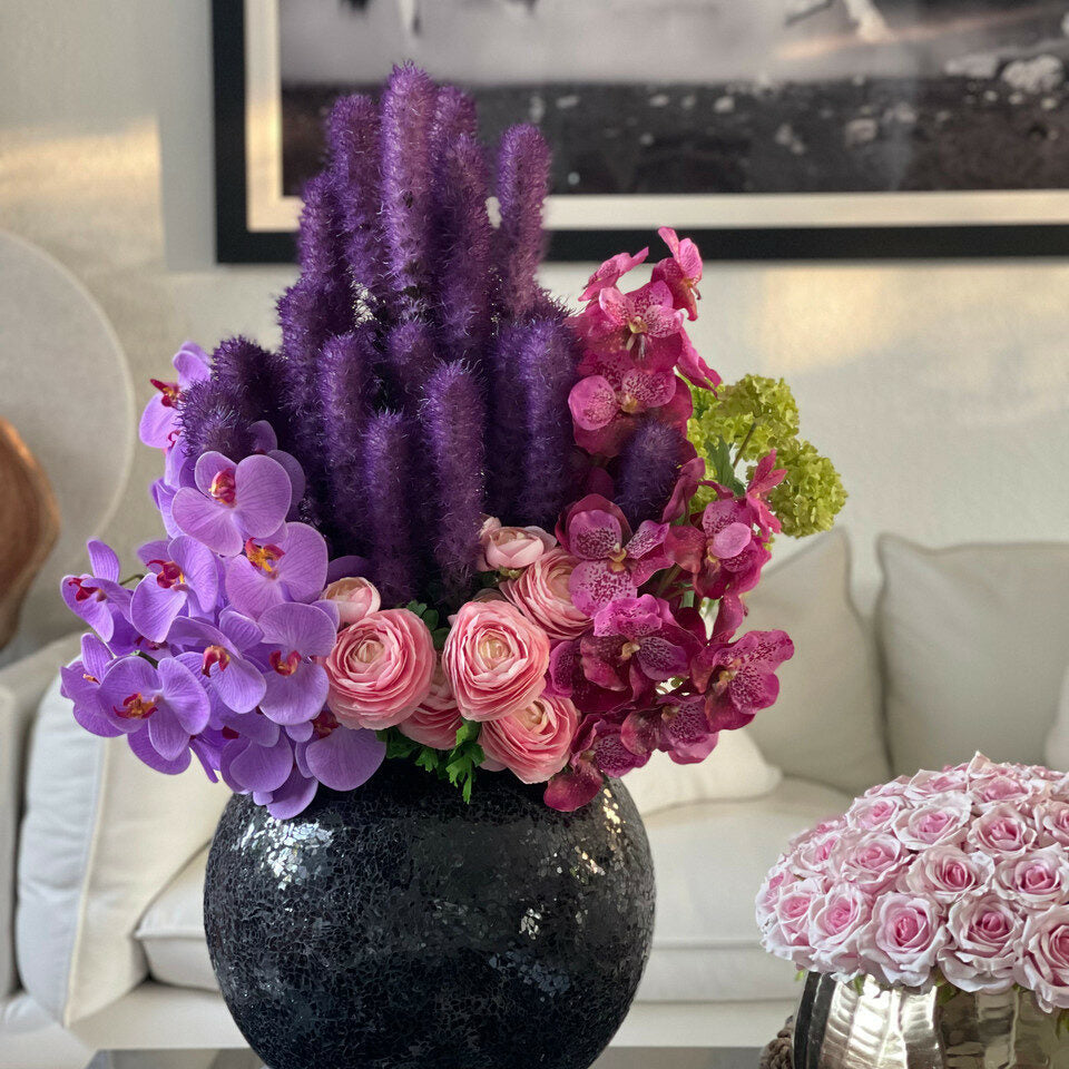 Black mosaic vase with liatris and orchids