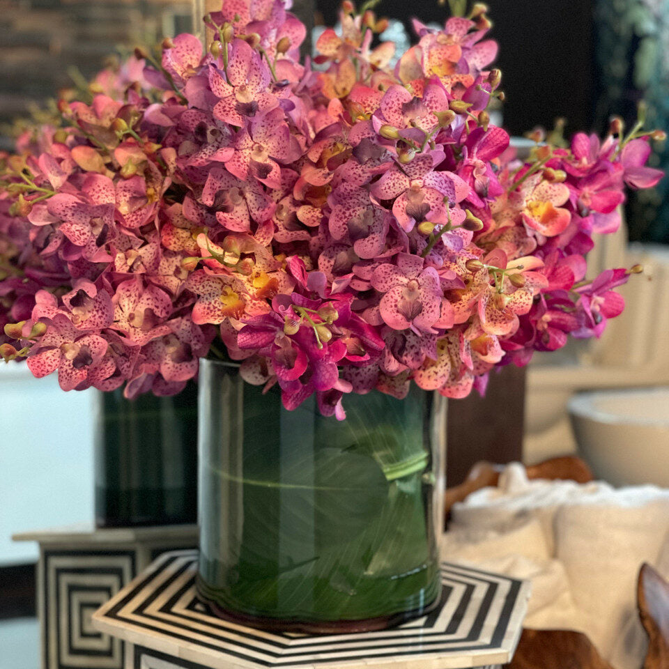 Mokara orchids mixed in a large Rota cylinder